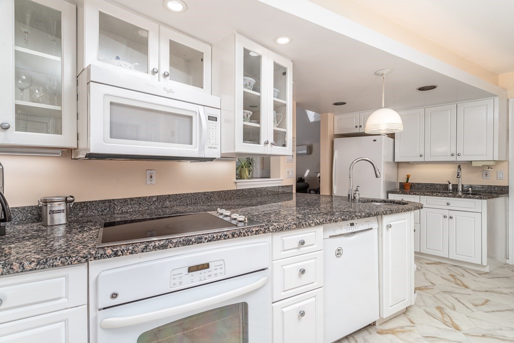 5 Lancaster Road Shirley, MA 01464 - Photo 4 of 42 a kitchen with stainless steel appliances granite countertop white cabinets and a granite counter tops