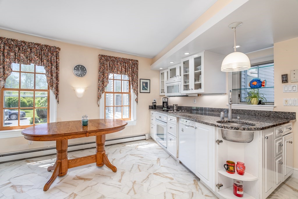 5 Lancaster Road Shirley, MA 01464 - Photo 5 of 42 a kitchen with granite countertop a sink and a stove top oven