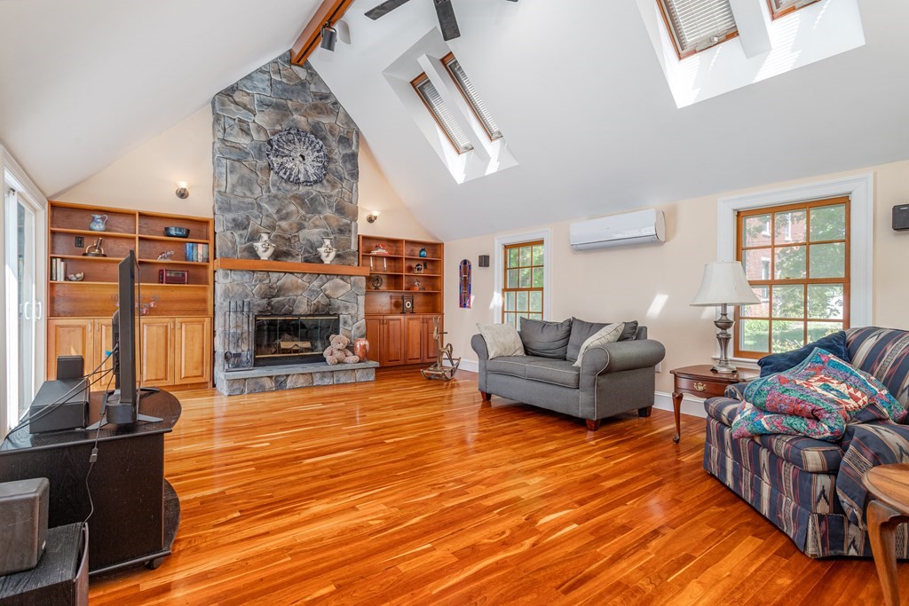5 Lancaster Road Shirley, MA 01464 - Photo 7 of 42 a living room with furniture and a fireplace