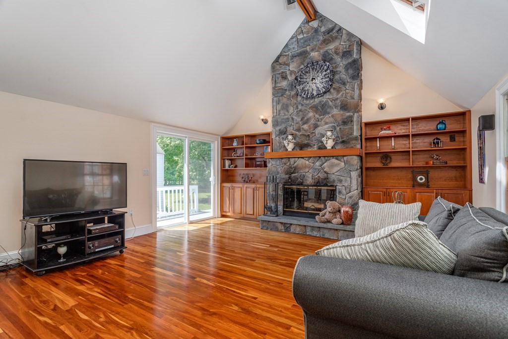 5 Lancaster Road Shirley, MA 01464 - Photo 9 of 42 a living room with furniture and a flat screen tv