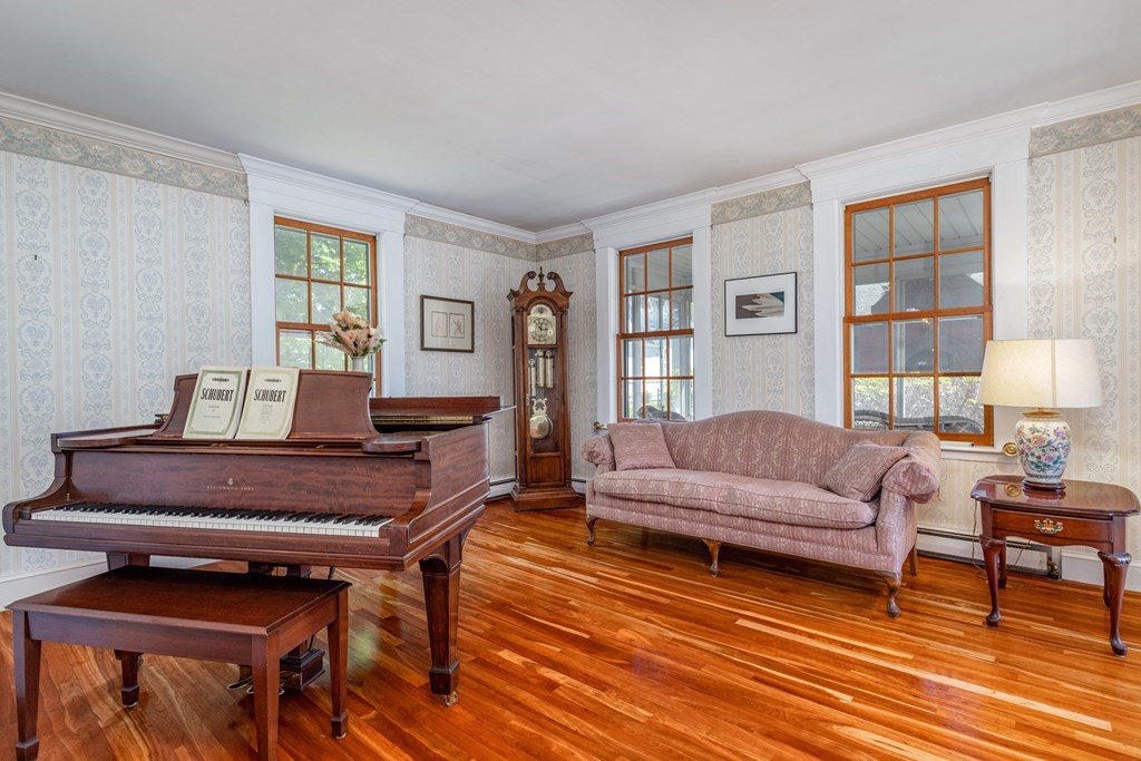 5 Lancaster Road Shirley, MA 01464 - Photo 10 of 42 a living room with furniture and a piano