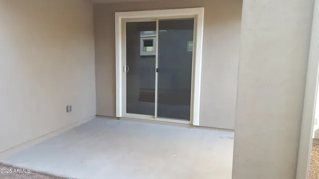 a view of an empty room with closet