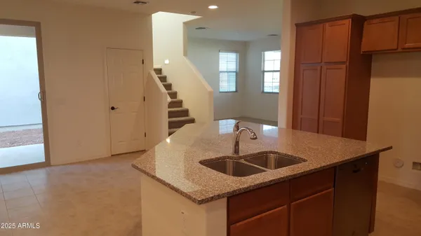 a kitchen with a sink and a refrigerator