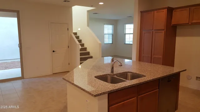 a kitchen with a sink and a refrigerator