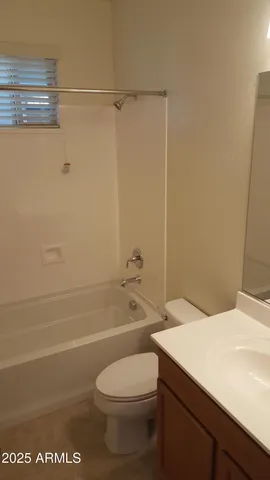a bathroom with a toilet a sink and shower