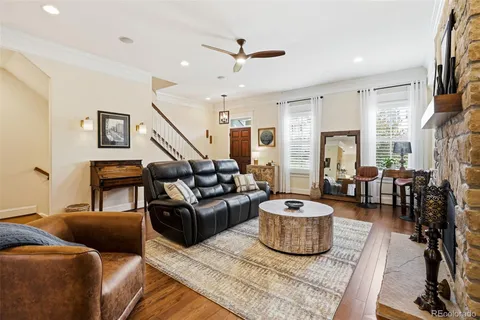 a living room with furniture and a chandelier