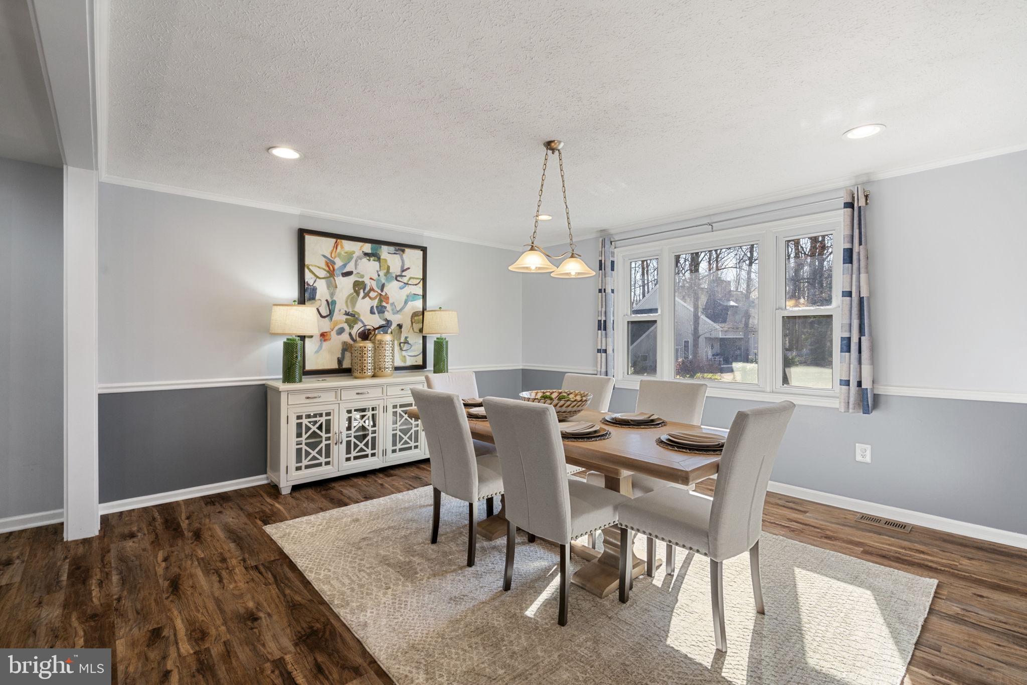 18607 Cabin Road Triangle, VA 22172 - Photo 17 of 64 a view of a dining room with furniture