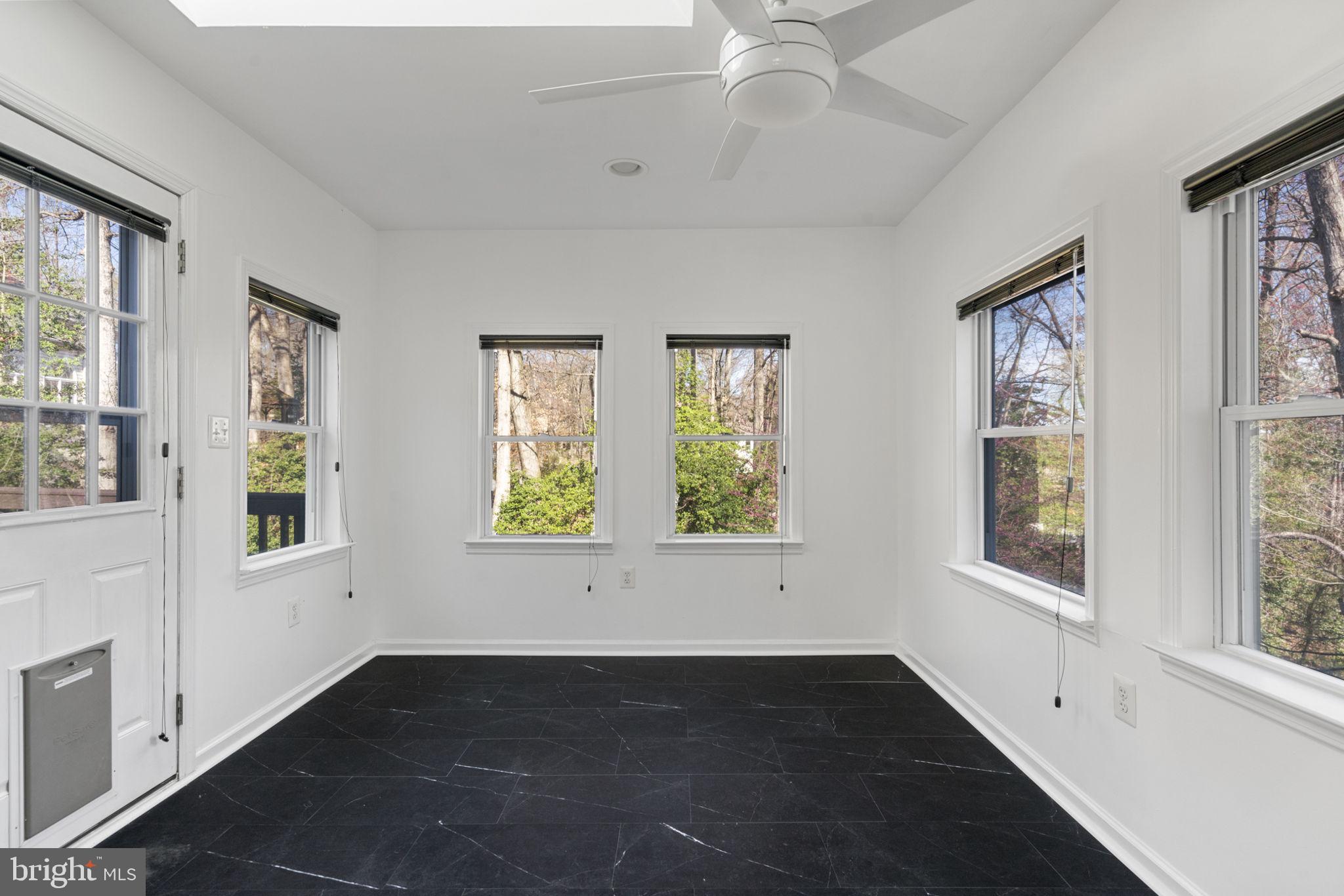 18607 Cabin Road Triangle, VA 22172 - Photo 19 of 64 a view of an empty room with wooden floor and a window