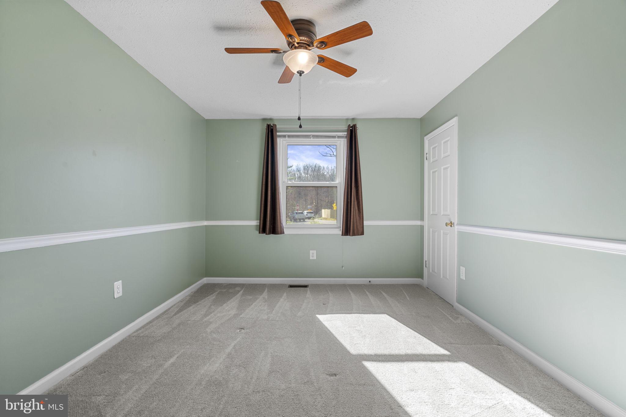 18607 Cabin Road Triangle, VA 22172 - Photo 21 of 64 a view of an empty room with a window