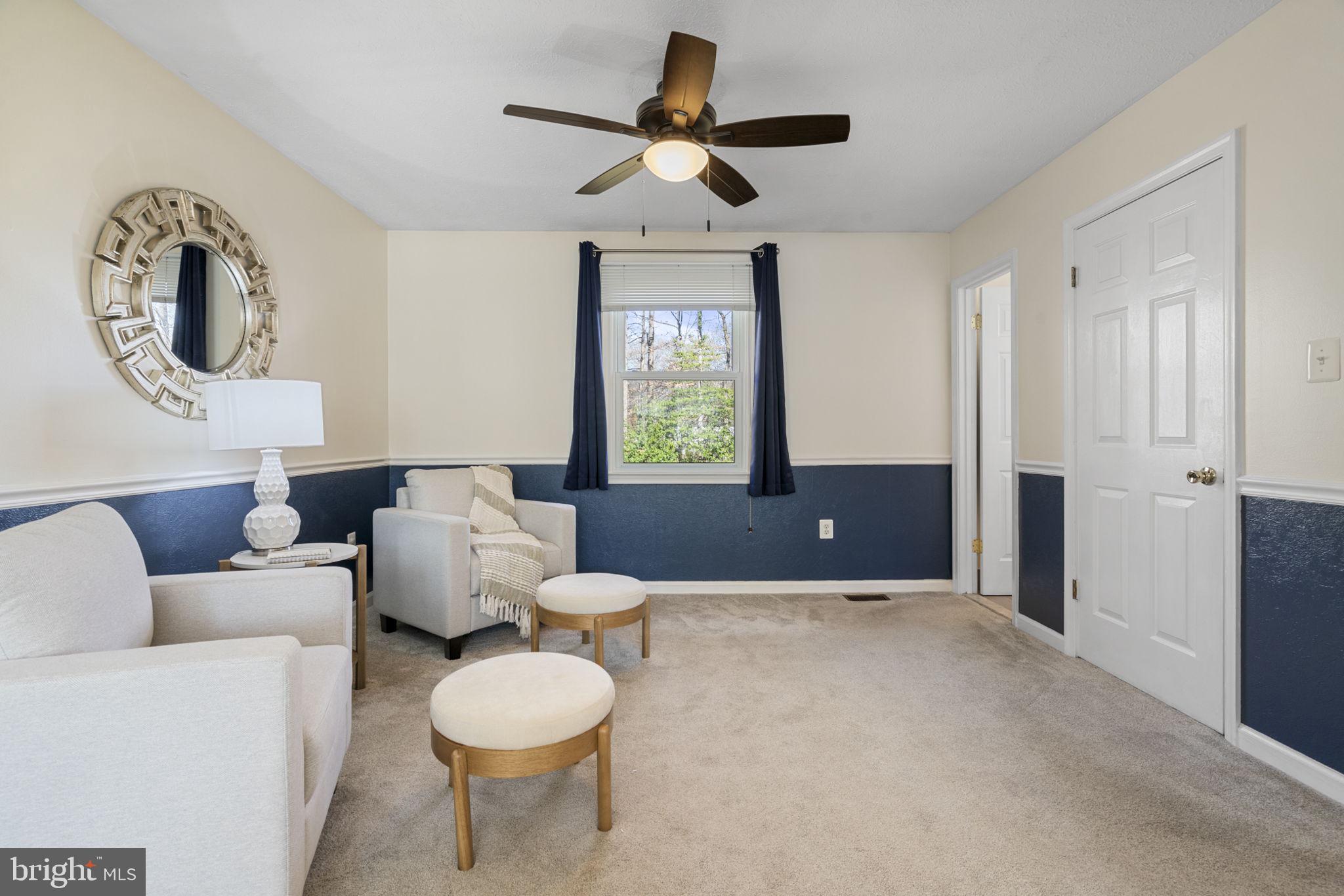 18607 Cabin Road Triangle, VA 22172 - Photo 25 of 64 a living room with furniture and a window