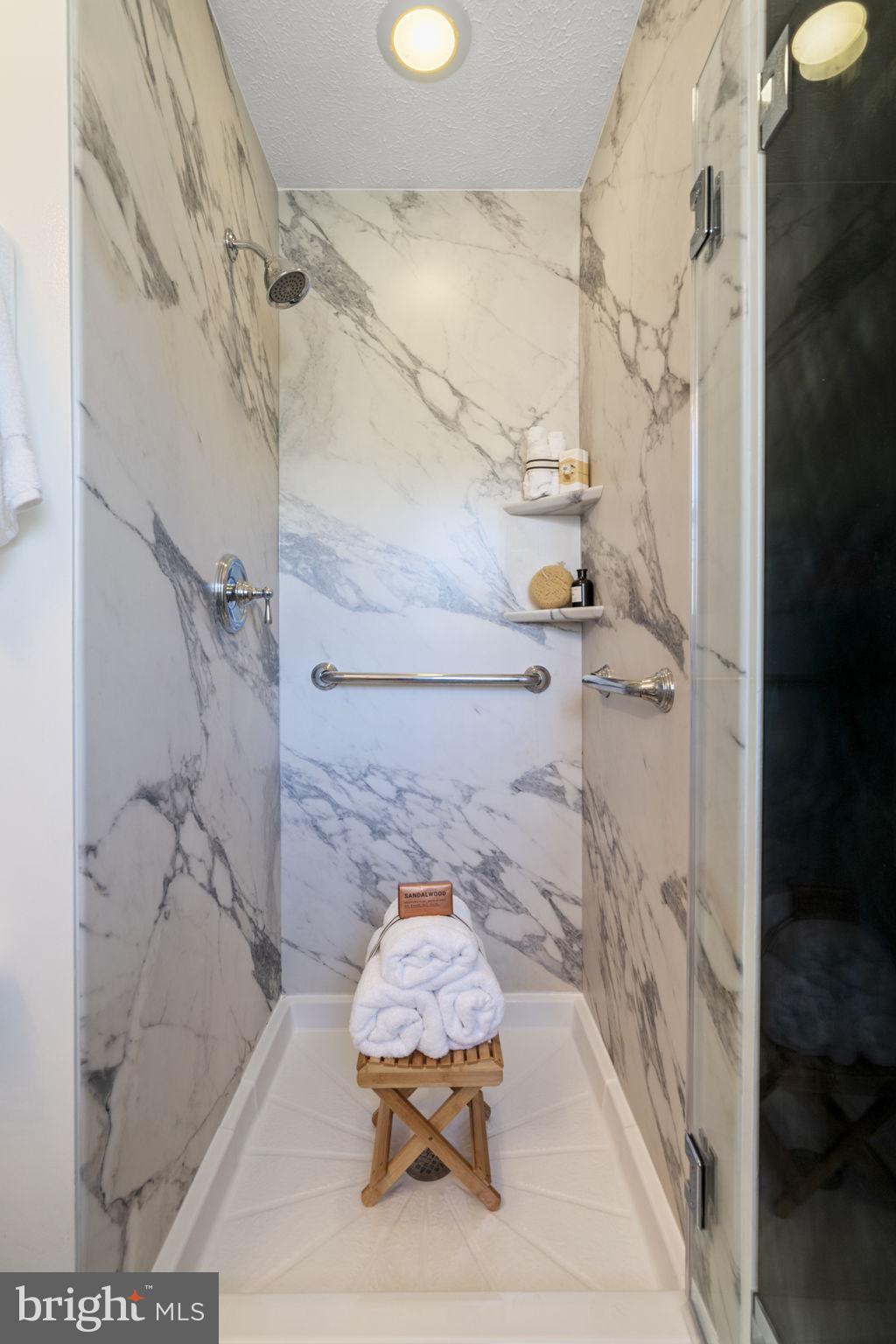 18607 Cabin Road Triangle, VA 22172 - Photo 29 of 64 a bathroom with a bathtub and shower