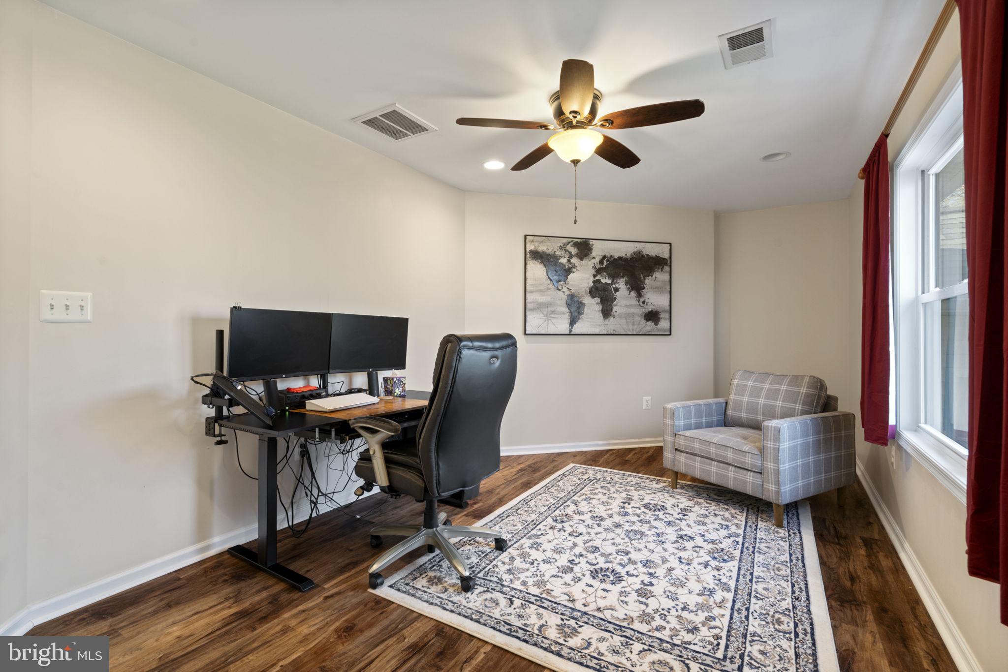 18607 Cabin Road Triangle, VA 22172 - Photo 32 of 64 a view of a workspace with furniture and a window
