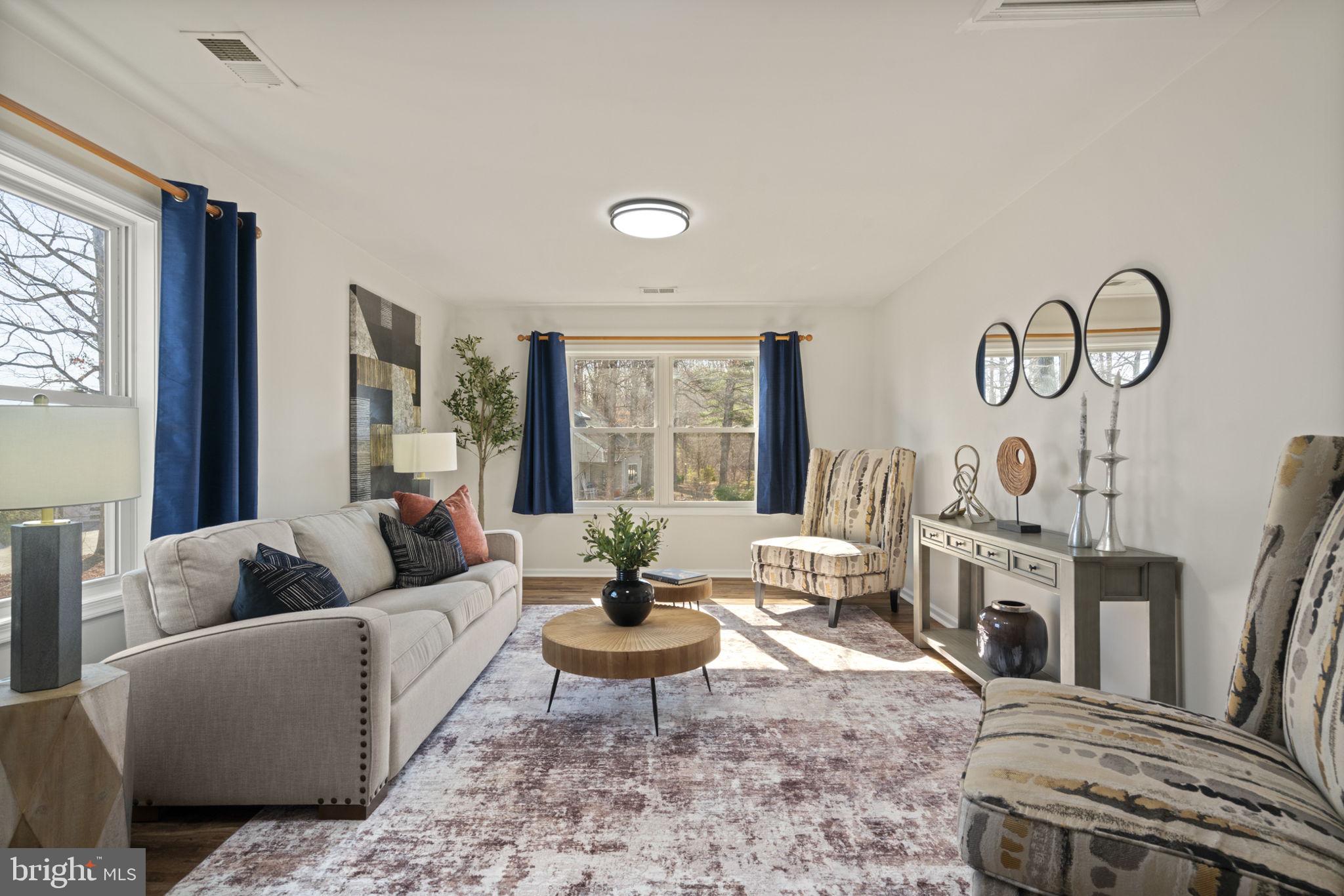 18607 Cabin Road Triangle, VA 22172 - Photo 33 of 64 a living room with fireplace furniture and a large window