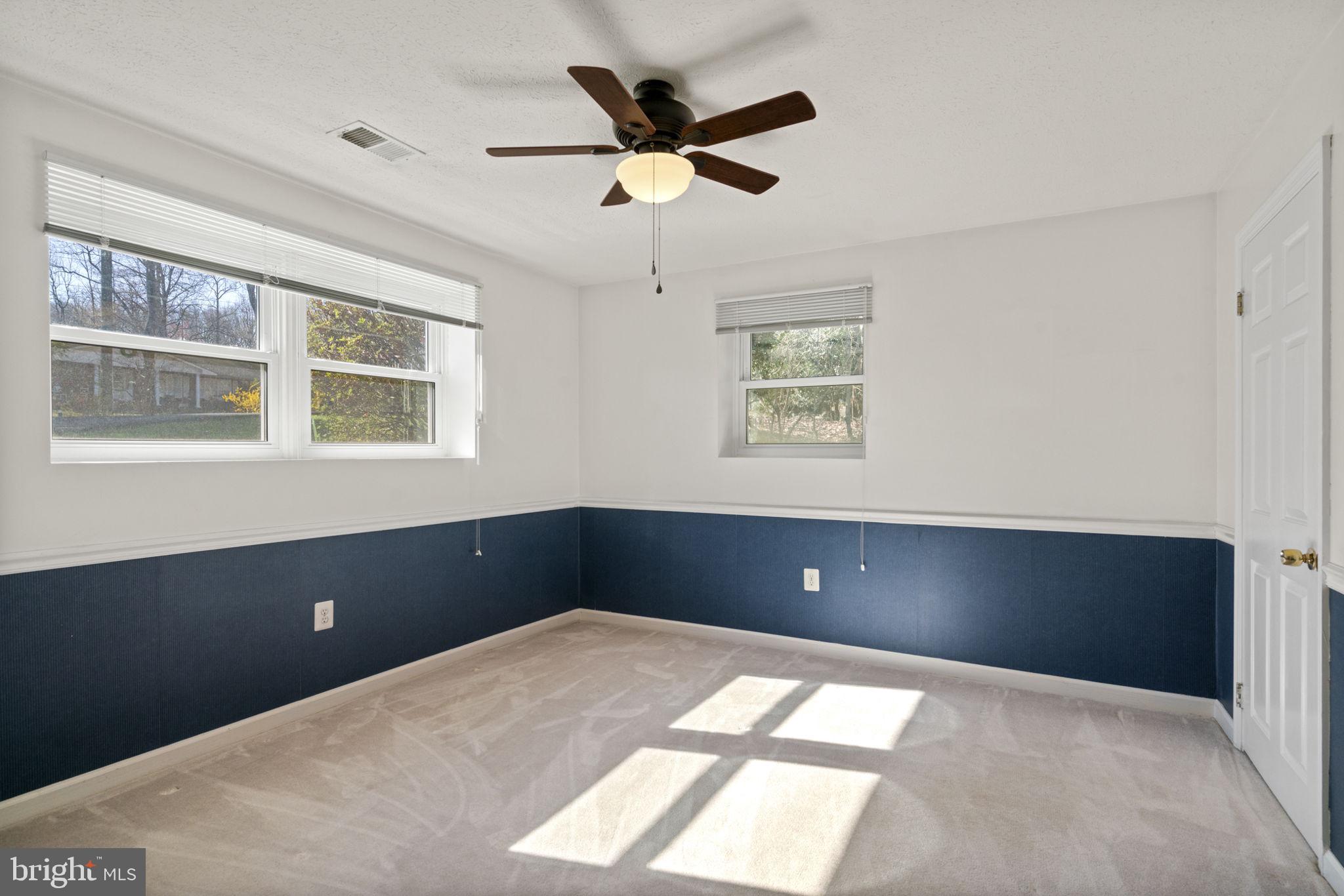 18607 Cabin Road Triangle, VA 22172 - Photo 42 of 64 a workspace room with a ceiling fan and window