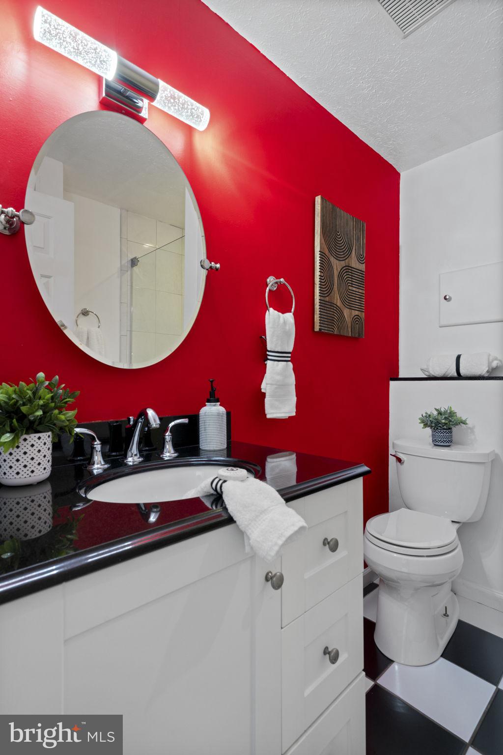 18607 Cabin Road Triangle, VA 22172 - Photo 44 of 64 a bathroom with a toilet a sink and mirror