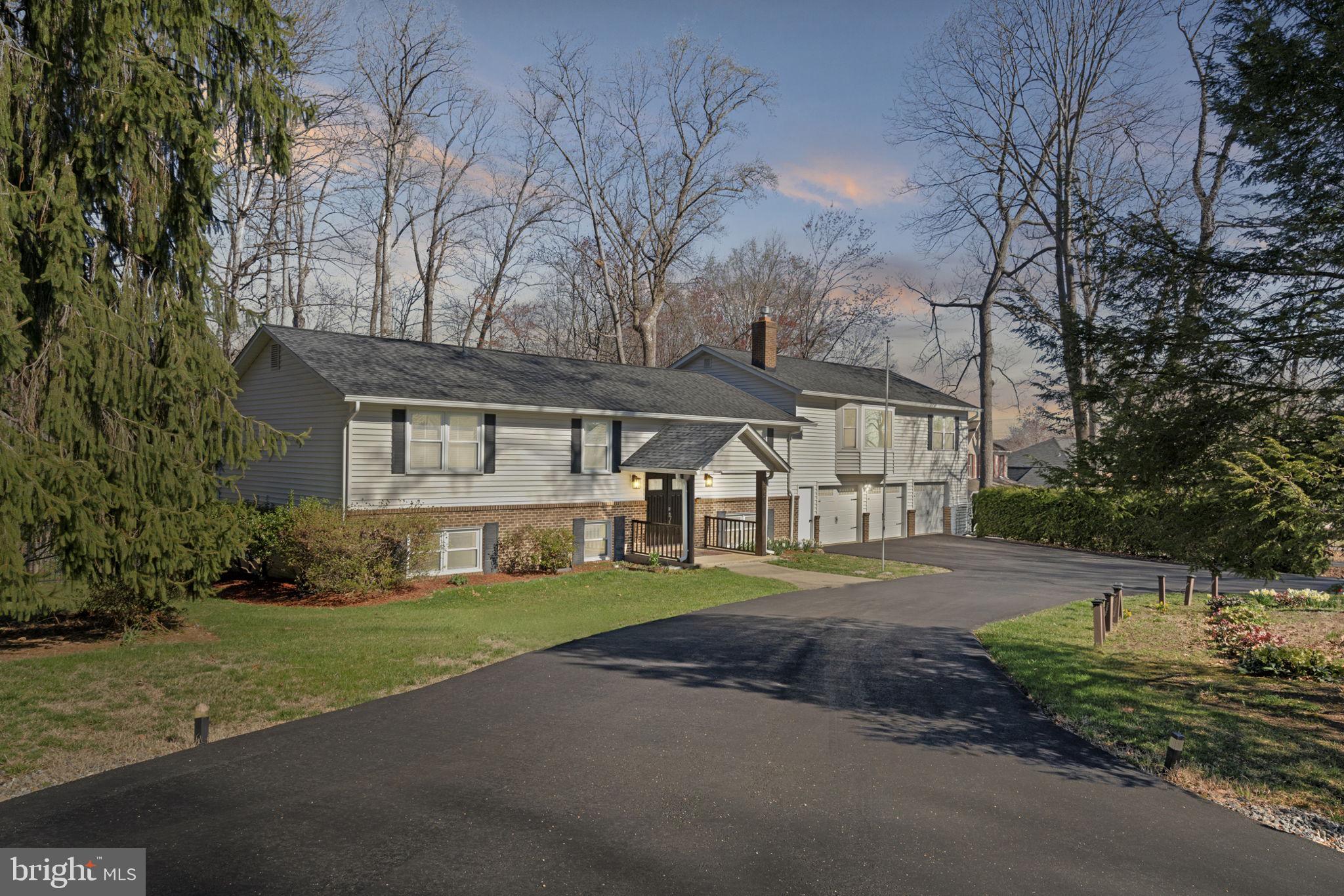 18607 Cabin Road Triangle, VA 22172 - Photo 63 of 64 a view of a big house with a big yard and large trees