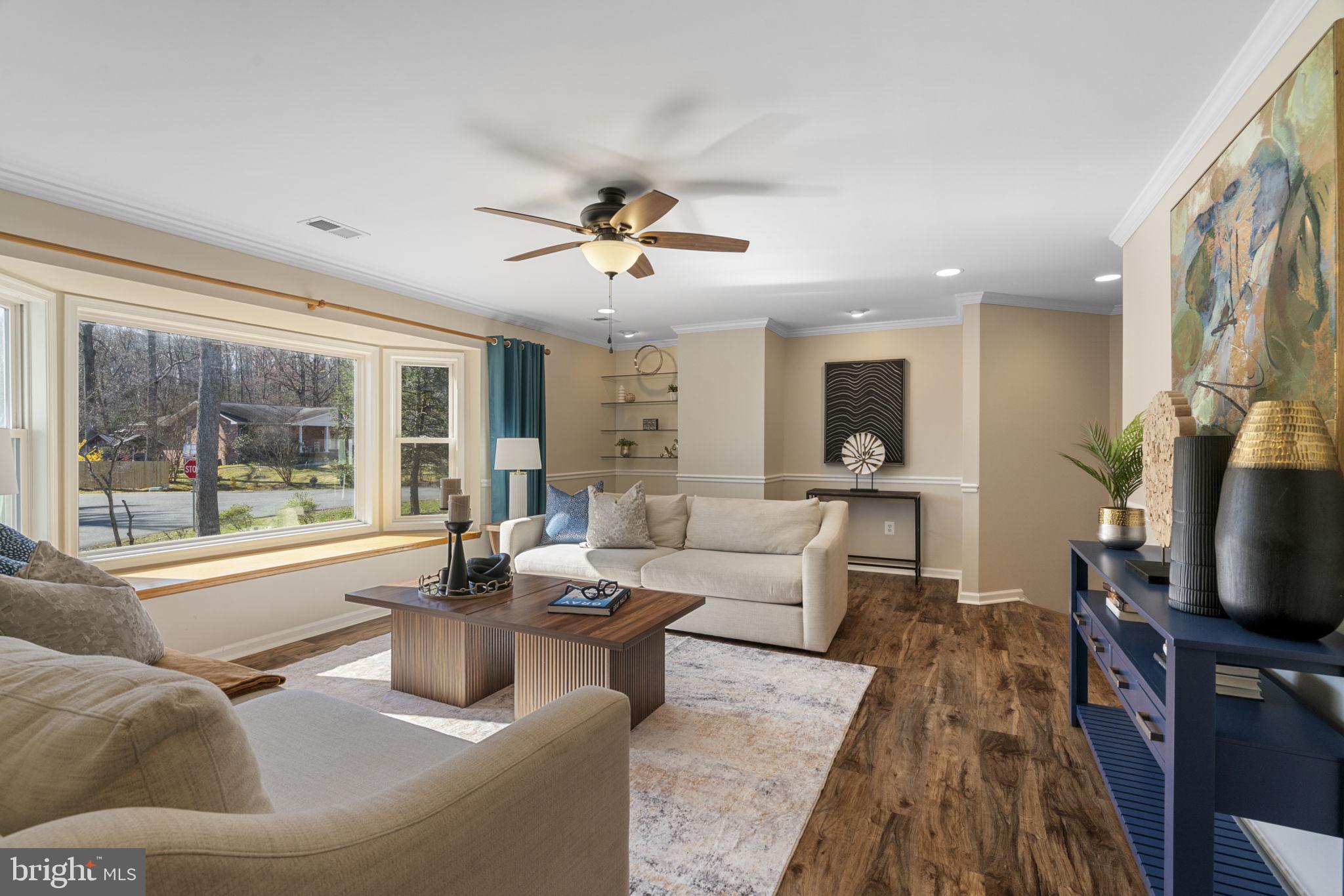 18607 Cabin Road Triangle, VA 22172 - Photo 7 of 64 a living room with fireplace furniture and a flat screen tv