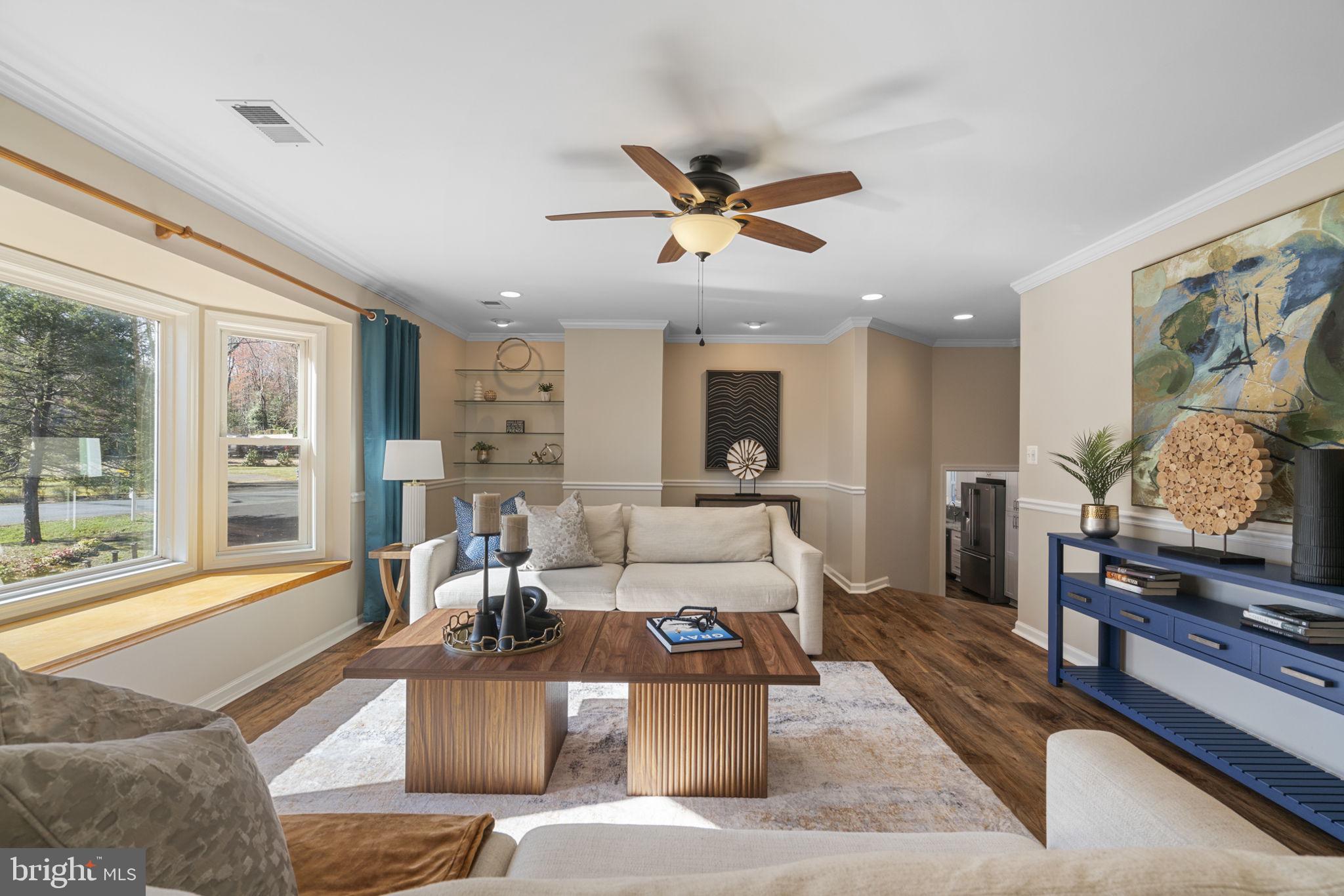18607 Cabin Road Triangle, VA 22172 - Photo 8 of 64 a living room with furniture and a flat screen tv