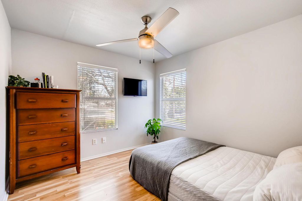 1312 Cometa Street, Unit A Austin, TX 78721 - Photo 14 of 18 Bedroom featuring light wood-type flooring and a ceiling fan