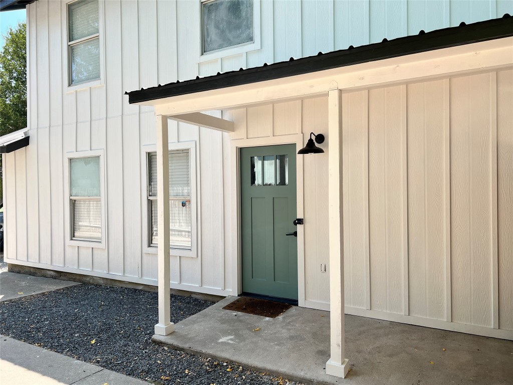 1312 Cometa Street, Unit A Austin, TX 78721 - Photo 16 of 18 View of exterior entry featuring board and batten siding