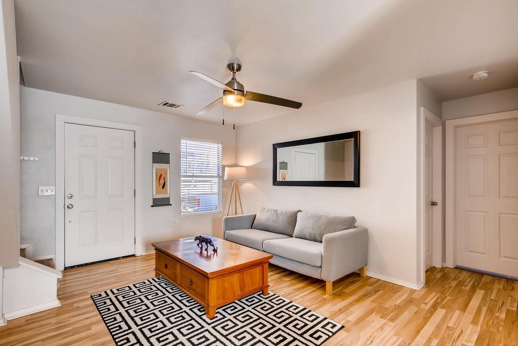 1312 Cometa Street, Unit A Austin, TX 78721 - Photo 7 of 18 Living area featuring light wood finished floors and ceiling fan