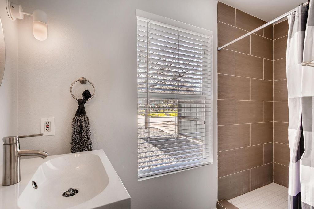 1312 Cometa Street, Unit A Austin, TX 78721 - Photo 8 of 18 Full bath with shower and vanity