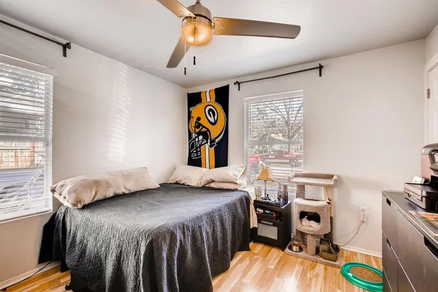 a bedroom that has a bed and a bookshelf in it
