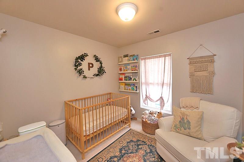 5121 Echo Ridge Road Raleigh, NC 27612 - Photo 11 of 16 a living room with furniture and a window