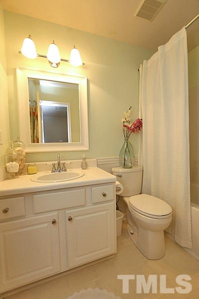 5121 Echo Ridge Road Raleigh, NC 27612 - Photo 12 of 16 a bathroom with a toilet sink and mirror