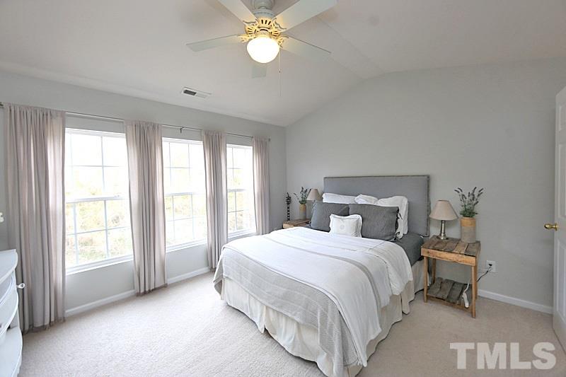 5121 Echo Ridge Road Raleigh, NC 27612 - Photo 7 of 16 a bedroom with a bed and a window