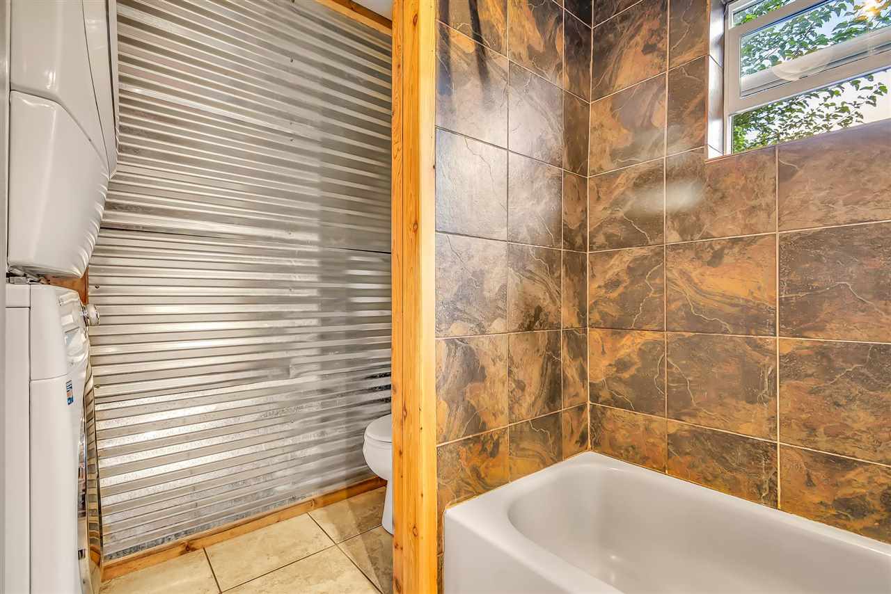 3301 F Road Clifton, CO 81520 - Photo 14 of 42 a bathroom with a bathtub and shower