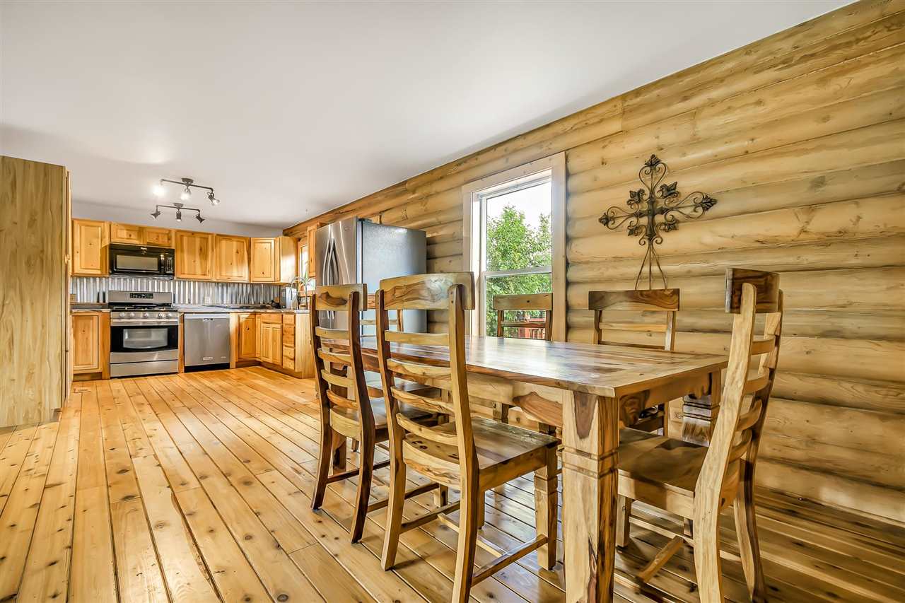 3301 F Road Clifton, CO 81520 - Photo 18 of 42 a view of a dining room with furniture and a kitchen view