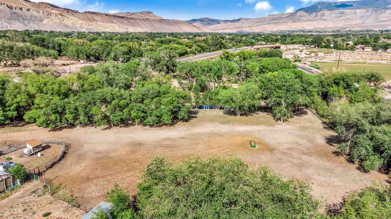 3301 F Road Clifton, CO 81520 - Photo 19 of 42 a view of a back yard with a lake view