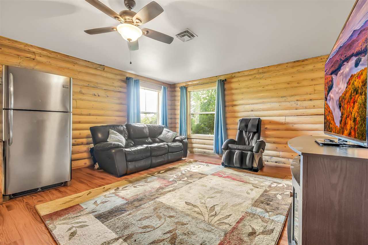 3301 F Road Clifton, CO 81520 - Photo 21 of 42 a living room with furniture and a flat screen tv