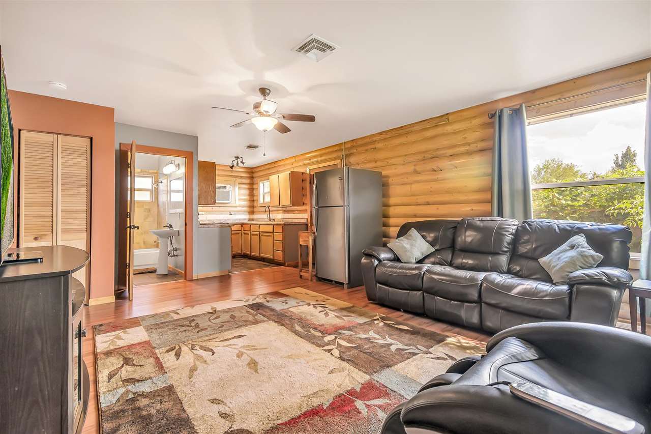 3301 F Road Clifton, CO 81520 - Photo 22 of 42 a living room with furniture and a large window