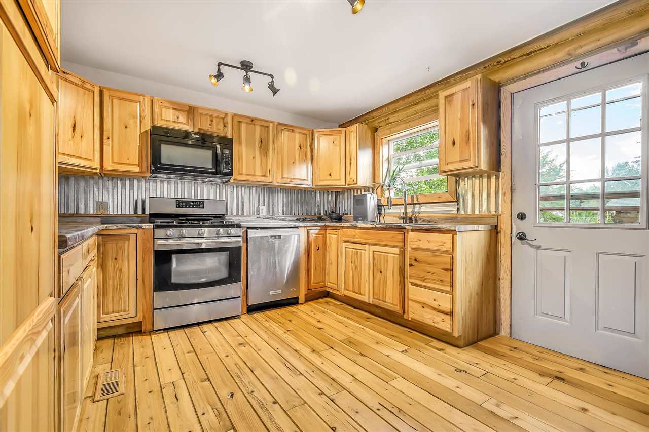 3301 F Road Clifton, CO 81520 - Photo 4 of 42 a kitchen with stainless steel appliances a stove top oven and a refrigerator