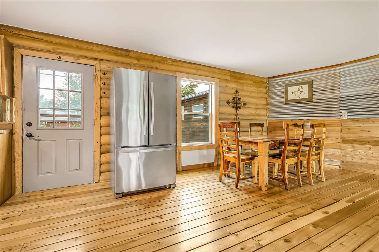 3301 F Road Clifton, CO 81520 - Photo 5 of 42 a view of a kitchen with a dining table chairs and entryway