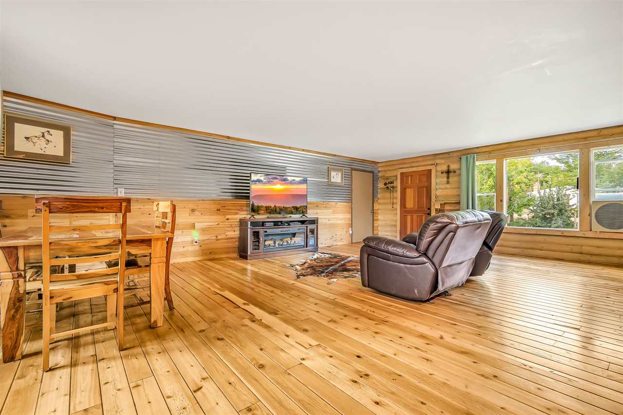 3301 F Road Clifton, CO 81520 - Photo 6 of 42 a living room with furniture and a flat screen tv