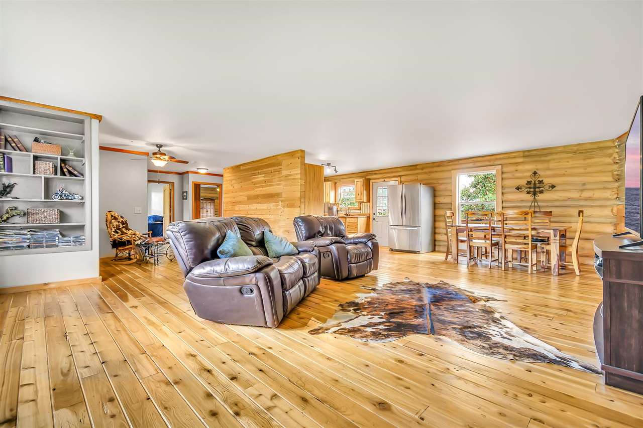 3301 F Road Clifton, CO 81520 - Photo 7 of 42 a living room with furniture large windows and wooden floor