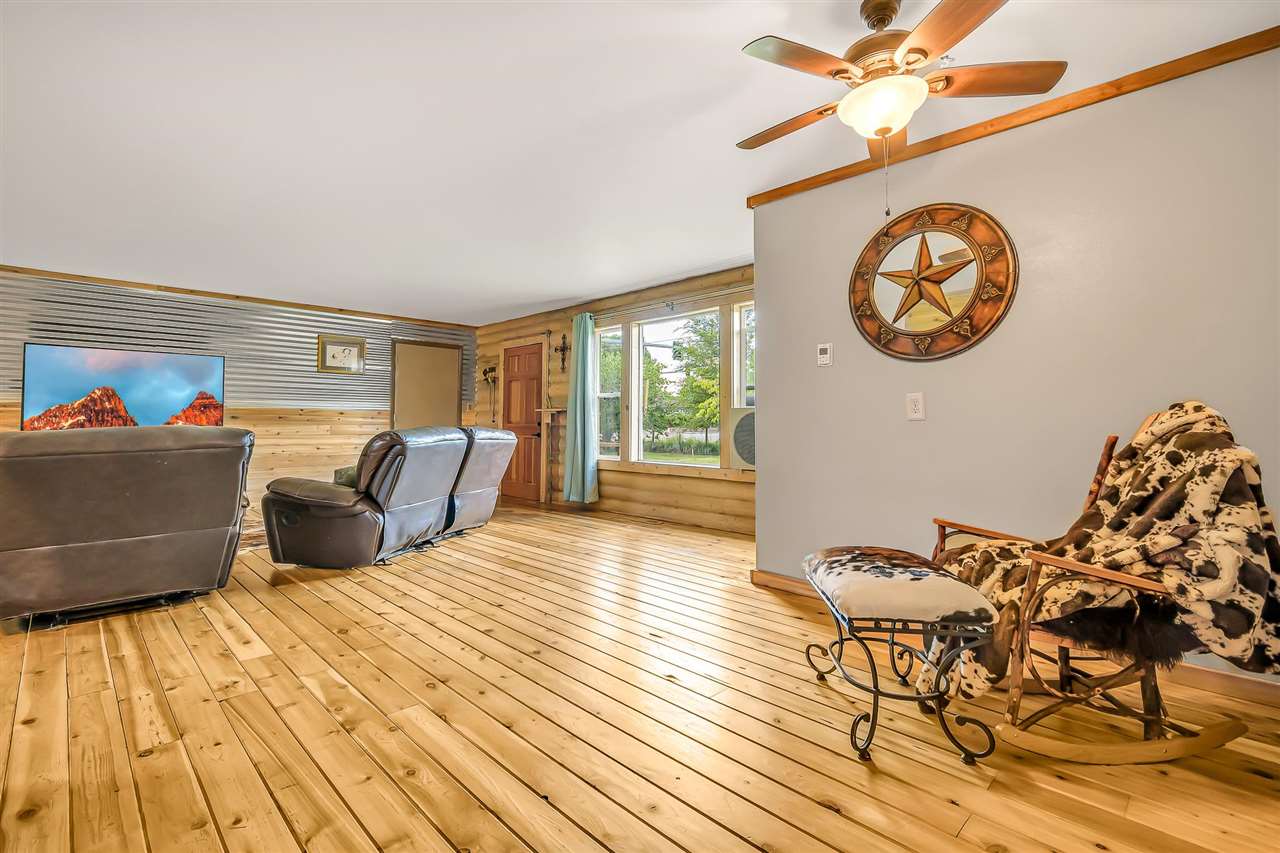 3301 F Road Clifton, CO 81520 - Photo 8 of 42 a bedroom with a bed and a chandelier