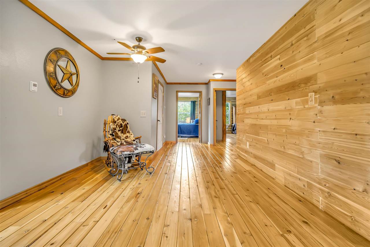3301 F Road Clifton, CO 81520 - Photo 10 of 42 a view of a room with wooden floor and chair
