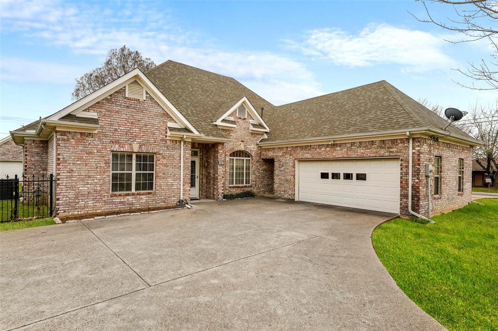 301 Elm Street Quinlan, TX 75474 - Photo 1 of 40 front view of a house with a yard