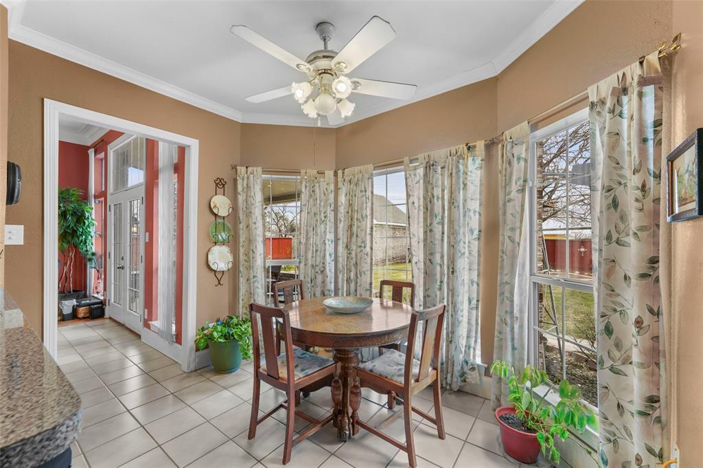 301 Elm Street Quinlan, TX 75474 - Photo 11 of 40 a view of a dining room with furniture and chandelier