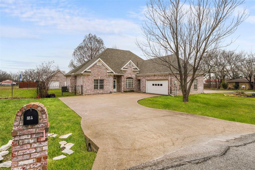 301 Elm Street Quinlan, TX 75474 - Photo 34 of 40 a view of house with a garden