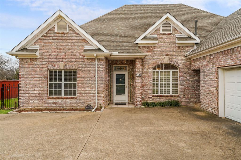 301 Elm Street Quinlan, TX 75474 - Photo 35 of 40 front view of a house with a yard