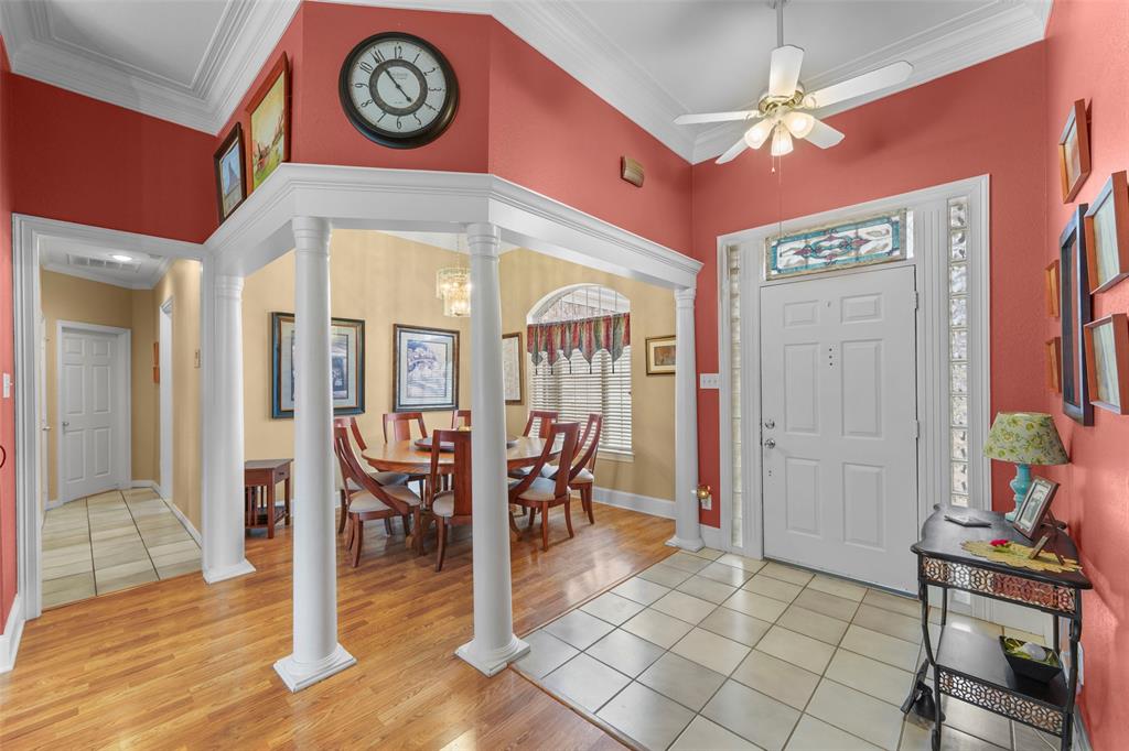 301 Elm Street Quinlan, TX 75474 - Photo 4 of 40 a view of a dining room with furniture window and wooden floor