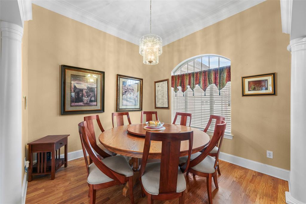 301 Elm Street Quinlan, TX 75474 - Photo 5 of 40 a view of a dining room with furniture and wooden floor
