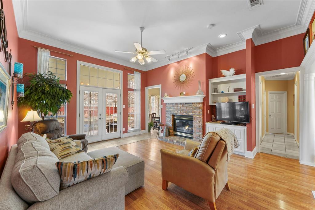 301 Elm Street Quinlan, TX 75474 - Photo 7 of 40 a living room with furniture fireplace and flat screen tv