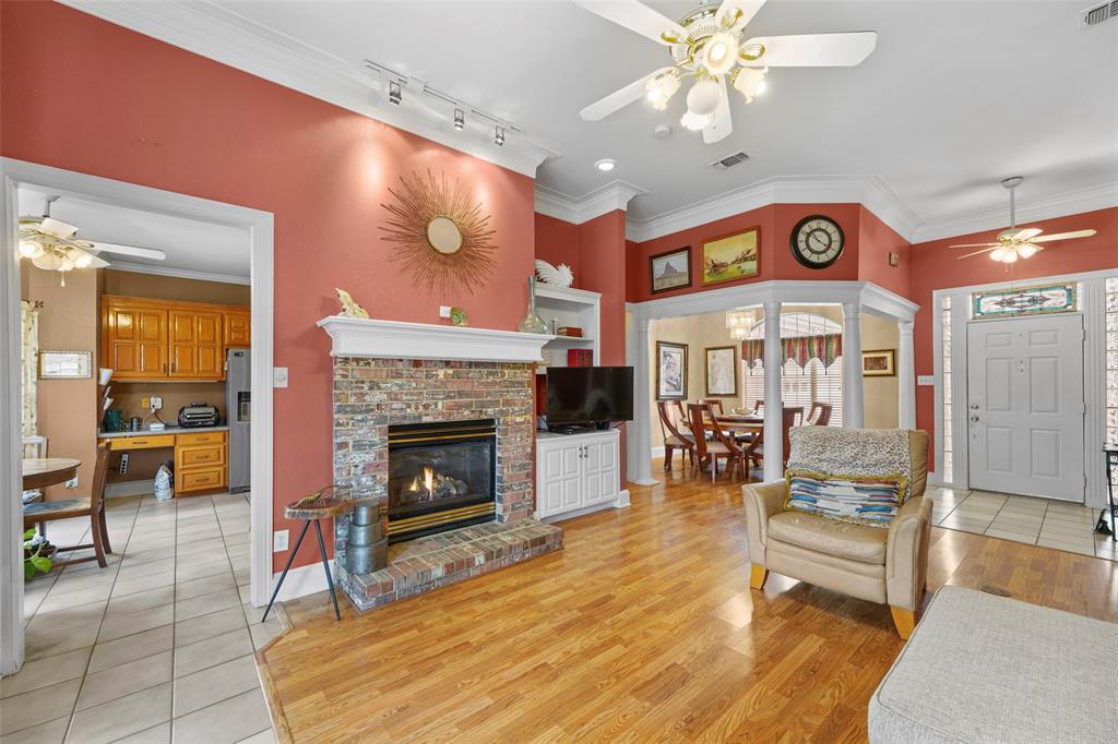 301 Elm Street Quinlan, TX 75474 - Photo 8 of 40 a living room with furniture and a fireplace