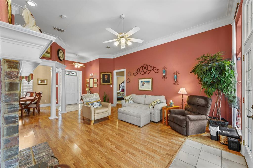 301 Elm Street Quinlan, TX 75474 - Photo 9 of 40 a living room with furniture and wooden floor